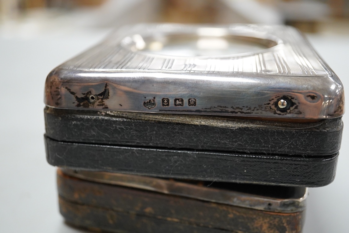 Two George V silver mounted travelling watch cases, both Birmingham, 1921, both containing chrome cased pocket watches. largest case 11.4cm.